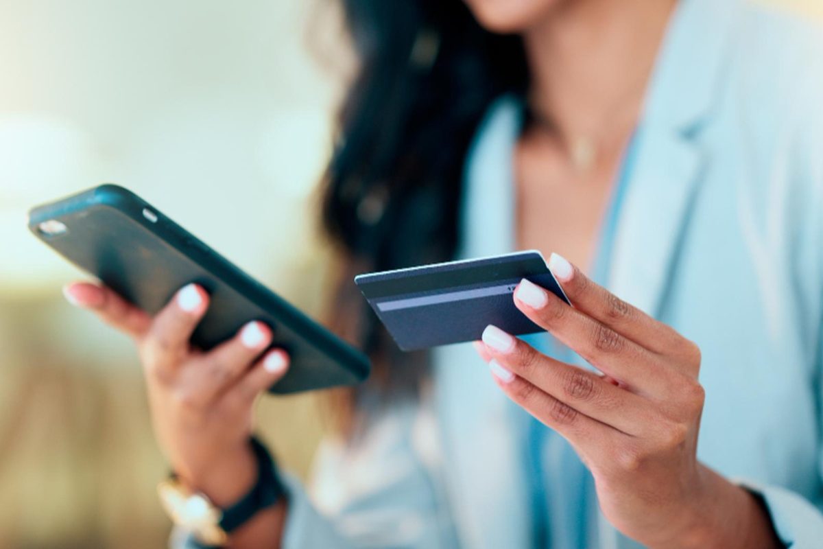 Patient paying for care with a card on her phone